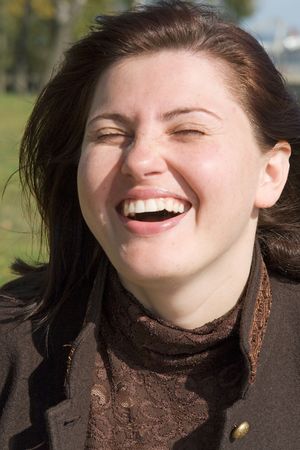 Happiness. The laughing beautiful woman close up.の写真素材