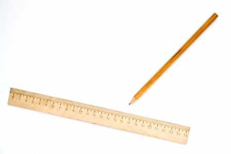 Wooden ruler and pencil on a white backgroundの写真素材