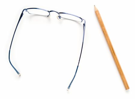 Glasses and pencil on a white backgroundの写真素材