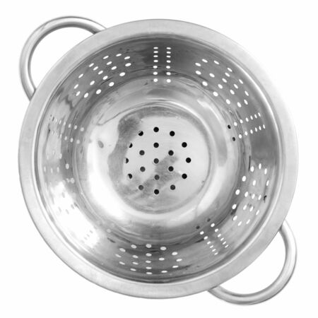 Steel kitchen colander on a white background.の写真素材