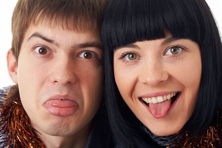 Sticking out tongue. Couple making funny silly face.の写真素材