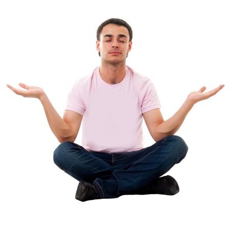 yoga. beautiful man meditates on a white background.の写真素材
