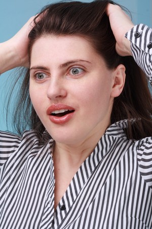 Surprised girl. Beautiful young woman close up.の写真素材
