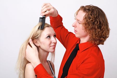 Hairstyle. He likes the way she does her hair.の写真素材