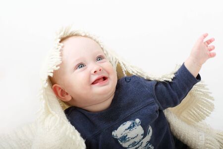 beautiful smiling baby with towel close upの写真素材
