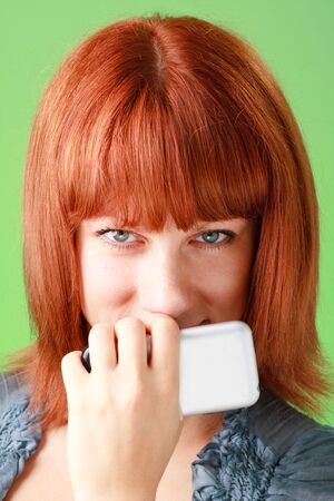 portrait of a young woman with mobile phone close upの写真素材
