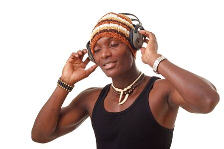 smiling young man with big headphones listening to music, isolated on a white background with copy spaceの写真素材