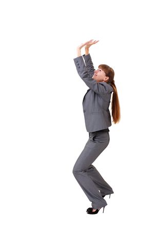 young businesswoman pushing something, isolated on a white background with copyspaceの写真素材