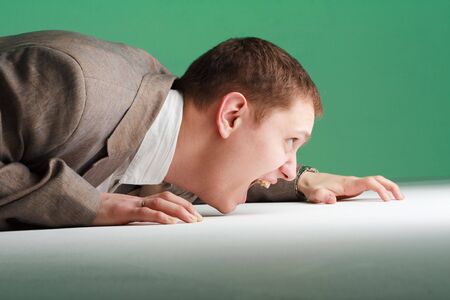 Crisis. Stressed young business man close up.の写真素材