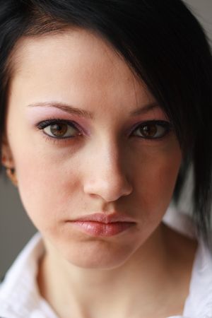 Sad girl. Close up portrait of young woman.