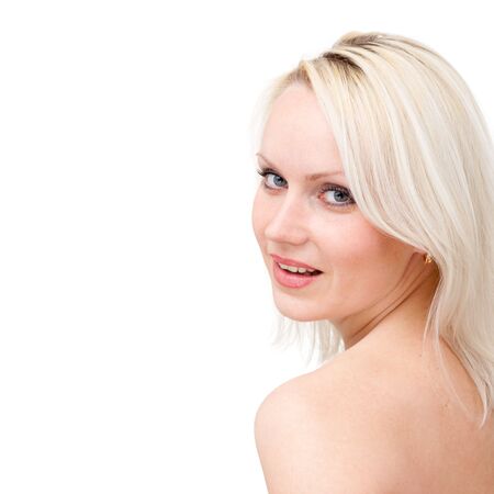Happy young woman close up on a white background with copyspace.の写真素材