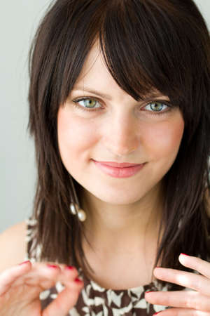 Closeup portrait of beautiful young smiling womanの写真素材