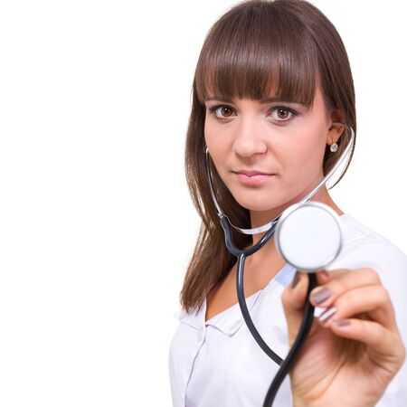 Young doctor with stethoscope,  isolated on a white background with copyspaceの写真素材
