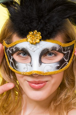 Closeup portrait of a woman wearing a carnival maskの写真素材