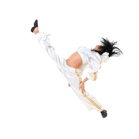 Young dancer  makes split against isolated white backgroundの写真素材