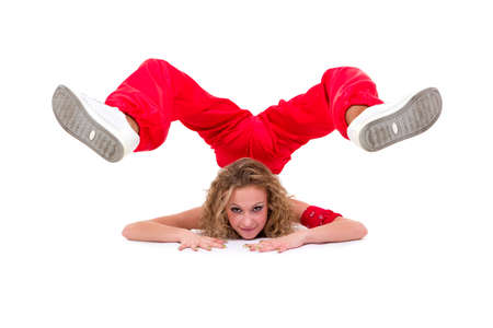 Young hip-hop dancer posing on a white backgroundの写真素材