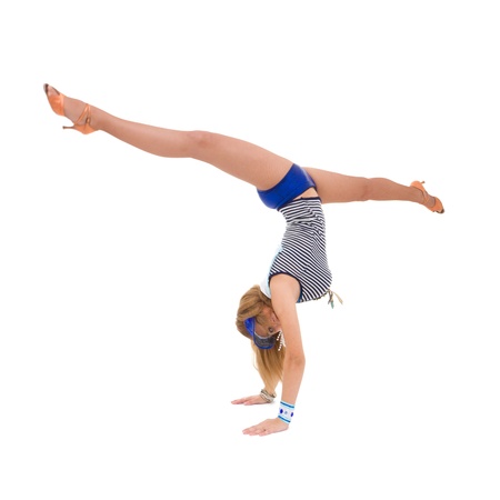 Young dancer  makes split against isolated white backgroundの写真素材