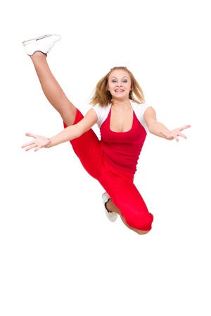 Happy young dancer jumping against isolated white backgroundの写真素材