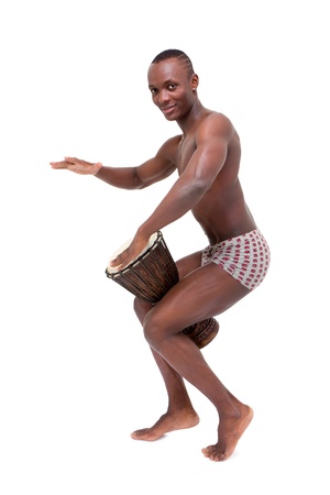 Happy man drumming on  tomtom on a white backgroundの写真素材