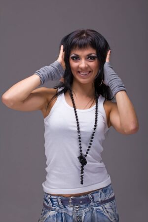 Closeup portrait of smiling woman on a gray background.の写真素材