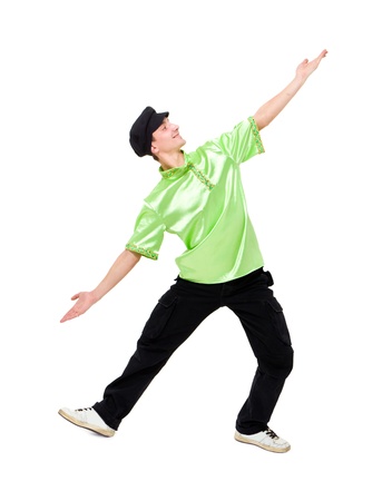 Happy young man dancing against isolated white backgroundの写真素材