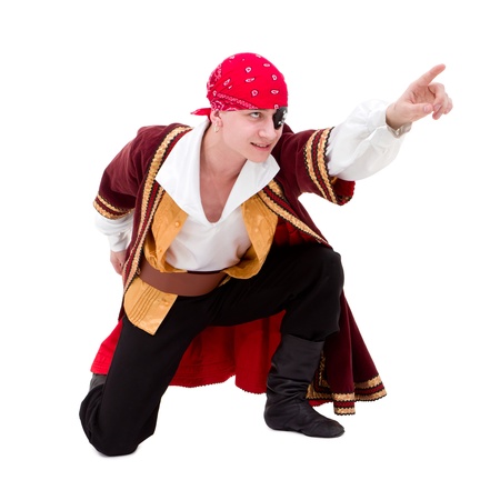 dancer dressed as pirate seated posing against isolated white backgroundの写真素材