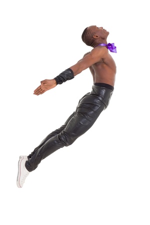 Jump. Young man dancing over a white backgroundの写真素材