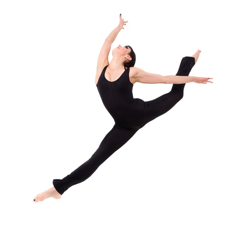 Young woman makes splits, jumping against isolated white backgroundの写真素材