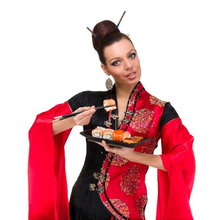 Woman in traditional dress with sushi, isolated on white background の写真素材