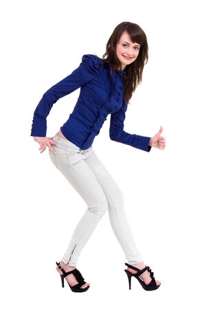 Smiling woman with thumbs up gesture posing against isolated white background の写真素材