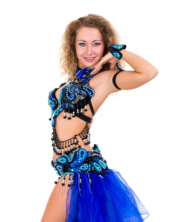 Belly dancer  Attractive woman dressed in a blue costume, isolated on white backgroundの写真素材