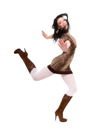 Attractive woman jumping against isolated white backgroundの写真素材