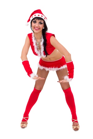 Young woman wearing santa claus clothes posing against isolated white backgroundの写真素材