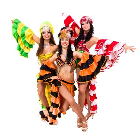 Three beautiful carnival dancers posing against isolated white backgroundの写真素材