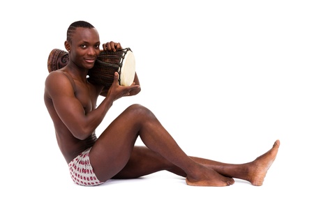 Sexy man with tomtom posing on a white backgroundの写真素材