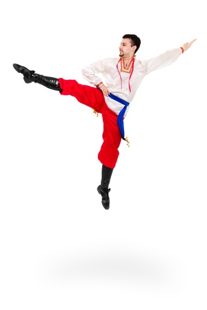 Man wearing a folk ukrainian costume jumping against isolated white backgroundの写真素材