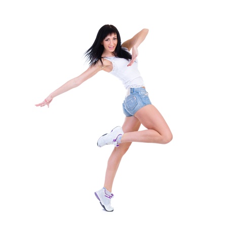 Young fitness woman doing exercise  Isolated on white background in full length の写真素材