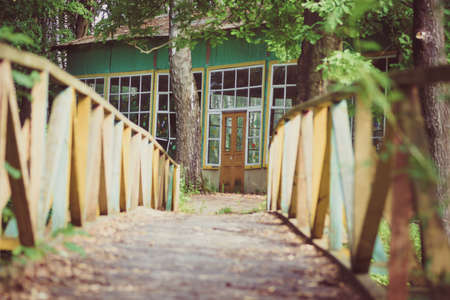 Wooden bridge to the old house  Vintage Styled 