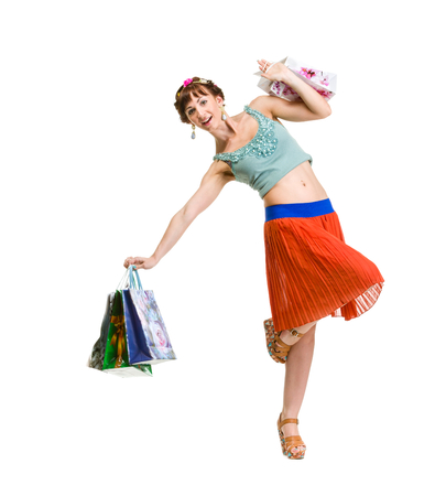 picture of lovely woman with shopping bags Isolated over white.の写真素材