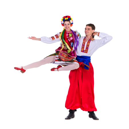 beautiful dancing couple in ukrainian polish national traditional costume clothes happy smile, full...