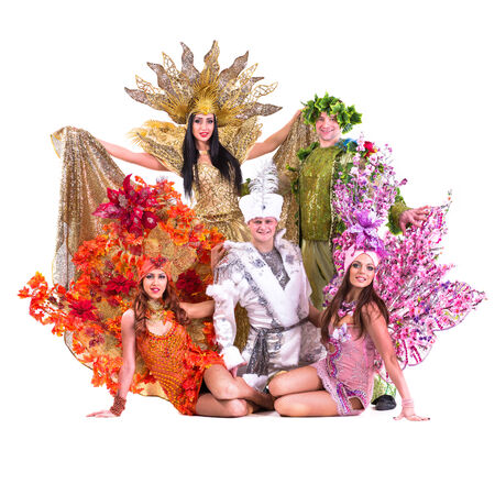 dancer team wearing carnival costumes dancing against isolated white backgroundの写真素材
