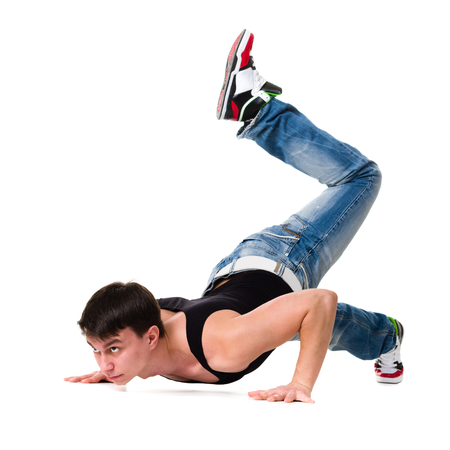 Handsome young man dancing isolated on white background in full body