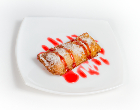 Delicious donuts on a plate, white background