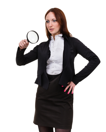 hocked woman searching finding clues with magnifying glass, isolated on whiteの写真素材
