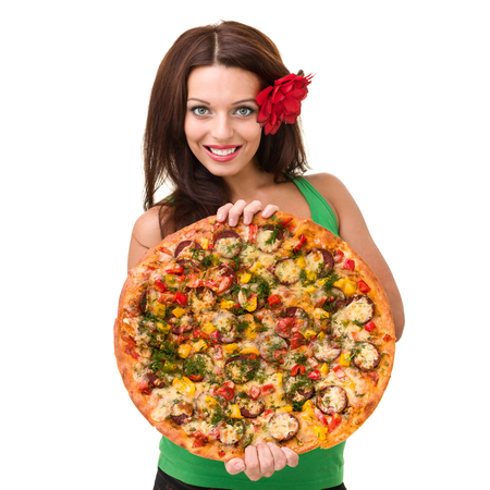 Smiling woman with big pizza isolated on a whiteの写真素材
