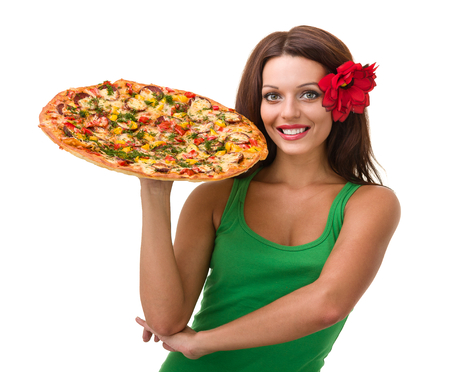 Smiling woman with big pizza isolated on a whiteの写真素材