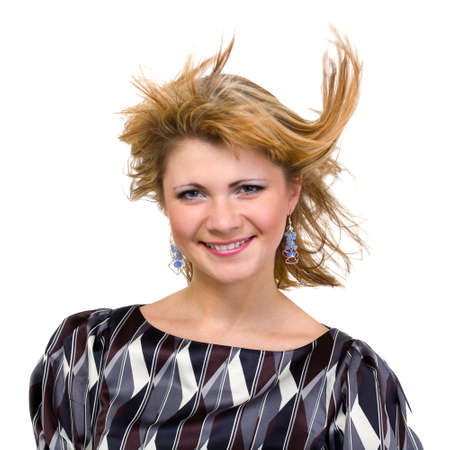 happy young woman with flying hair on whiteの写真素材