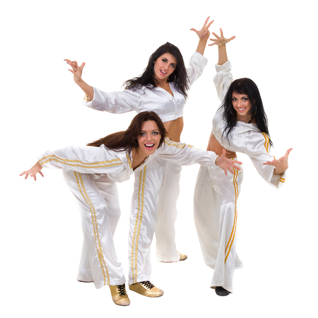 Modern dancer team dancing, isolated on white in full length.の写真素材