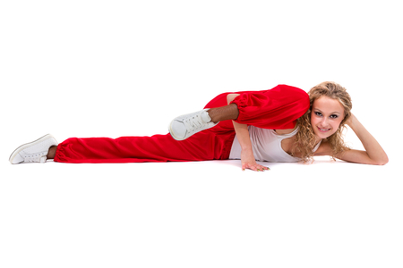 fitness woman doing exercises, isolated on white background in full length.の写真素材
