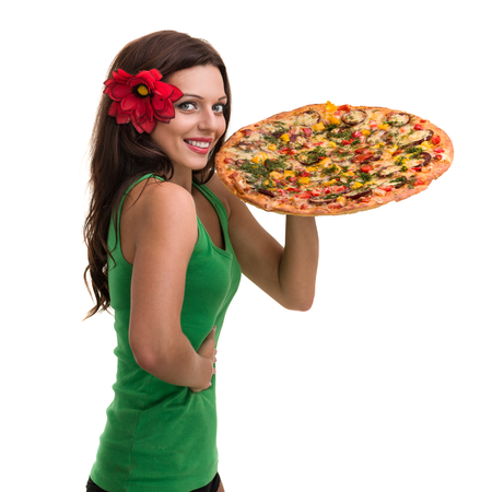 Smiling woman with big pizza isolated on a whiteの写真素材